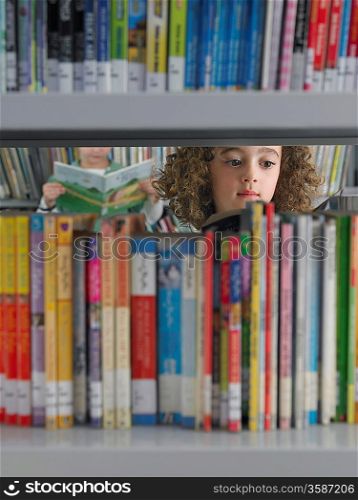 Elementary Student Reading in Library