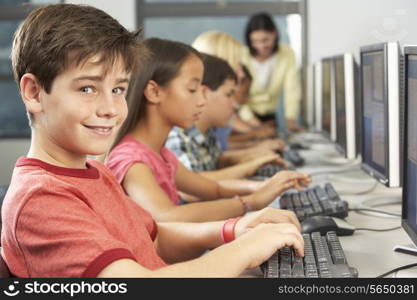 Elementary Students Working At Computers In Classroom