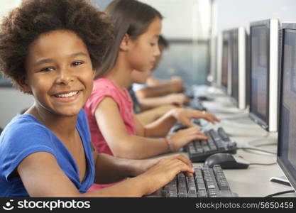 Elementary Students Working At Computers In Classroom