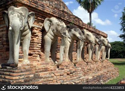 Elephants and brick wall in old Sukhotai, Thailand