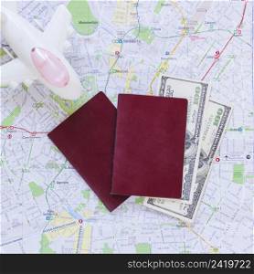elevated view airplane passport banknotes map