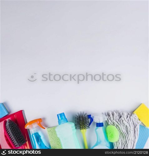 elevated view cleaning equipments bottom grey background