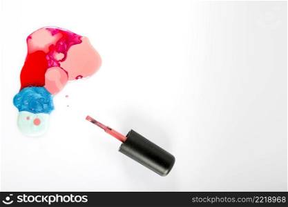 elevated view colorful nail polish white background