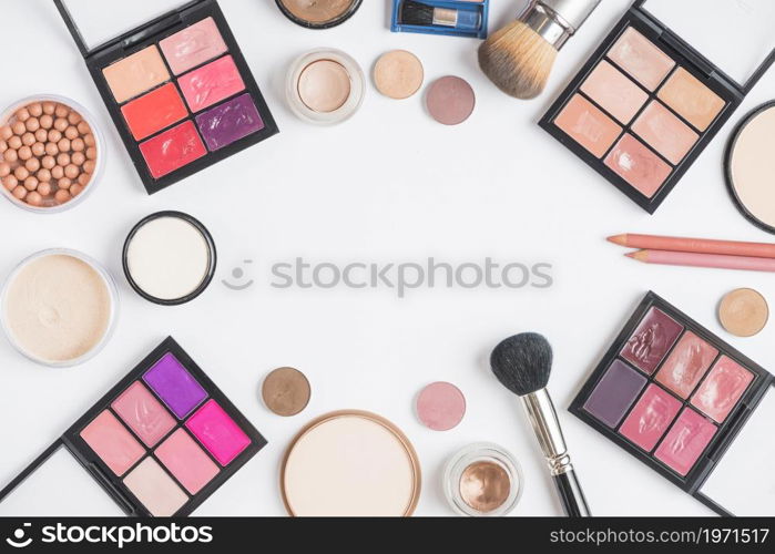 elevated view cosmetic products forming frame white background. High resolution photo. elevated view cosmetic products forming frame white background. High quality photo