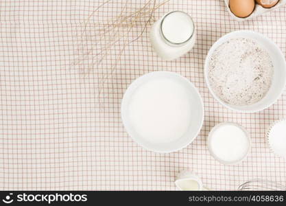 elevated view flour milk sugar egg checkered napkin