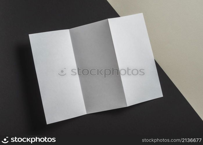 elevated view folded white paper brochure