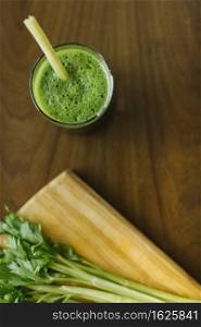 elevated view fresh green smoothie wooden desk