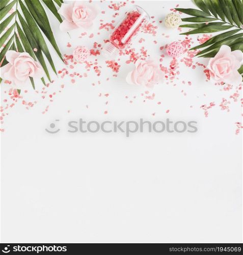elevated view himalayan salt leaves flowers white backdrop. High resolution photo. elevated view himalayan salt leaves flowers white backdrop. High quality photo