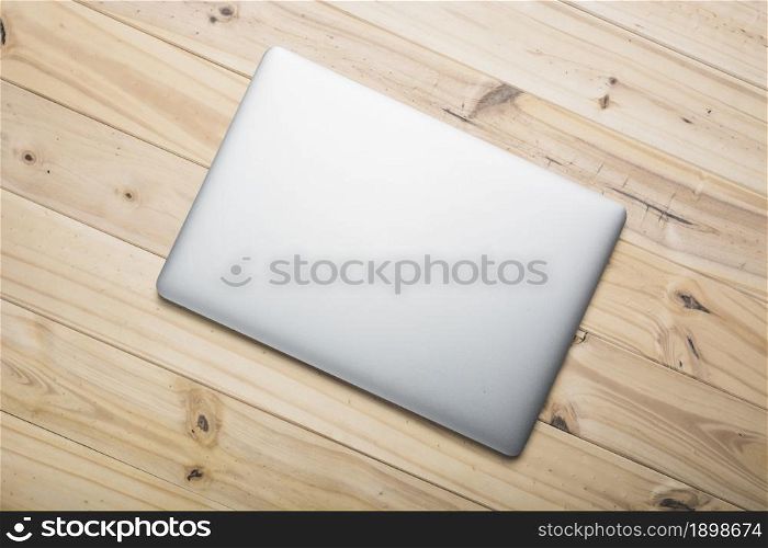 elevated view laptop wooden plank. Resolution and high quality beautiful photo. elevated view laptop wooden plank. High quality beautiful photo concept