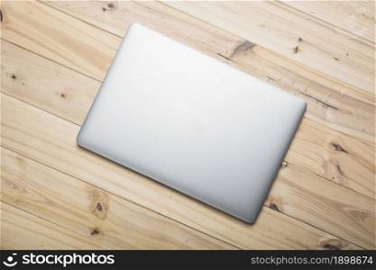 elevated view laptop wooden plank. Resolution and high quality beautiful photo. elevated view laptop wooden plank. High quality beautiful photo concept