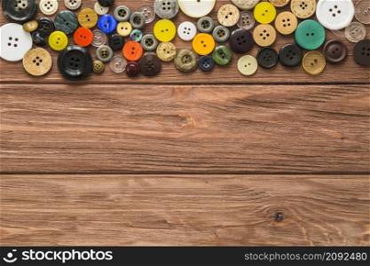 elevated view multi colored buttons wooden background