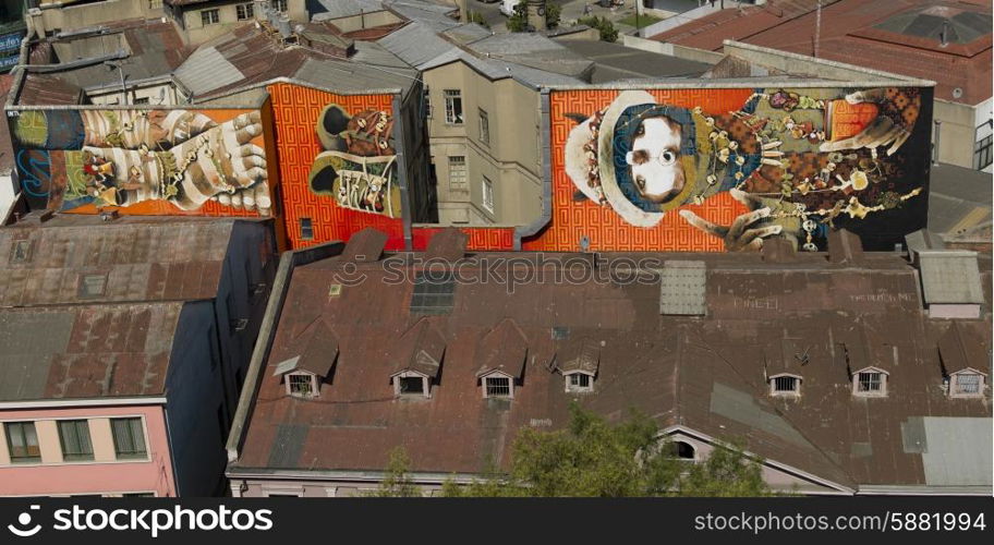 Elevated view of buildings with painted mural, Valparaiso, Chile