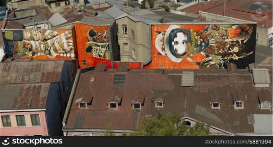 Elevated view of buildings with painted mural, Valparaiso, Chile