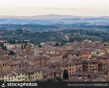 Elevated view of houses in city, Siena, Tuscany, Italy