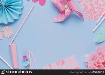 elevated view origami crafts art straw blue background