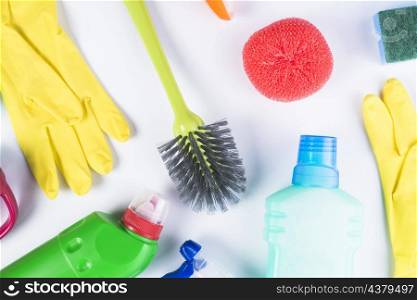 elevated view scattered cleaning equipments grey background