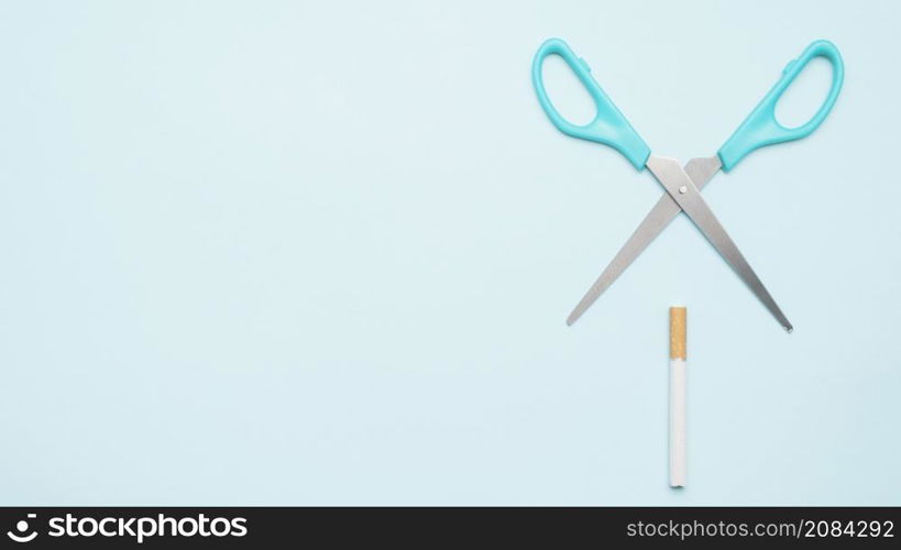 elevated view scissor with cigarette blue backdrop