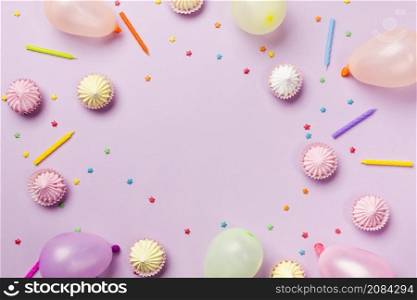 elevated view sprinkles candles balloons aalaw pink background