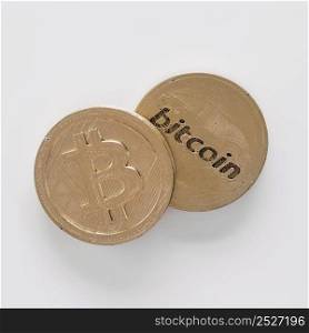 elevated view two bitcoins white background