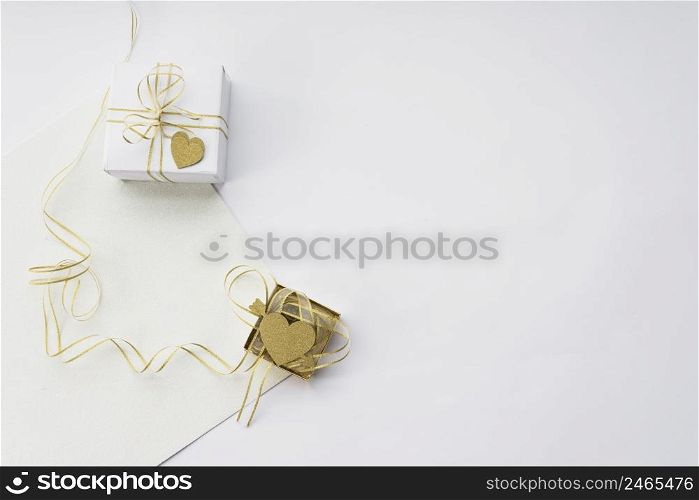elevated view two gift box with blank paper white backdrop