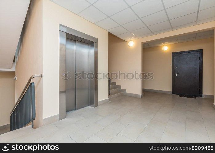 Elevator and stairs up and down in a modern elegant building. Elevator and stairs