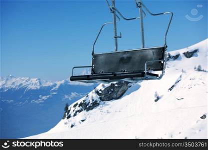 elevator ski mountains on background