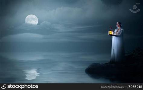 Elven girl on sea coast at night