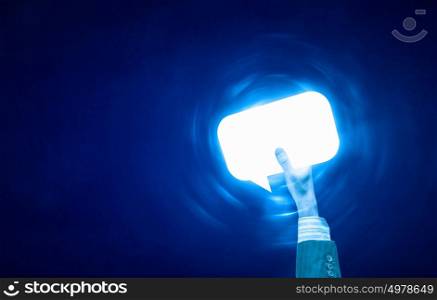 Email concept. Person hand holding glowing email symbol on blue background