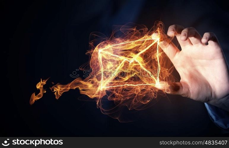 Email messaging concept. Glowing light email symbol on dark background