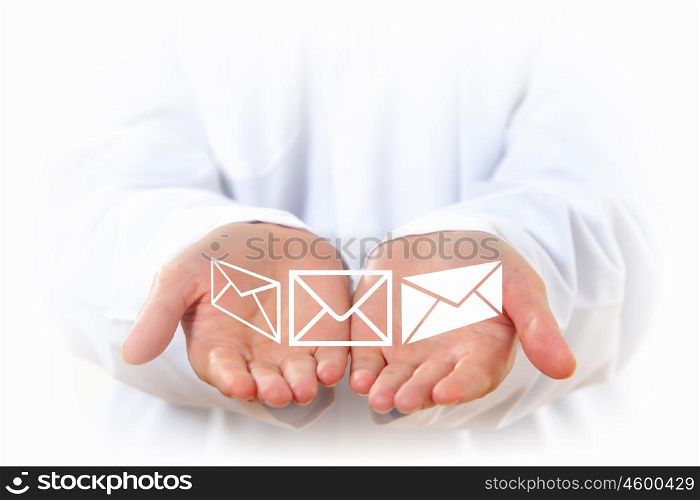 Emailing. Close up of human hands with mail white symbols