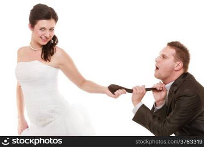 Emancipation. Humorous funny wedding couple bride and groom isolated. Woman pulling the tie of man, wife showing her domination over husband.