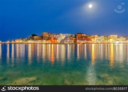 Embankment and the mosque Kucuk Hasan Pasha in night light. Chania. Crete. Greece.. Chania. The old harbor at night.