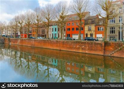 Embankment of the river Leie with reflections colored houses in Ghent town, Belgium