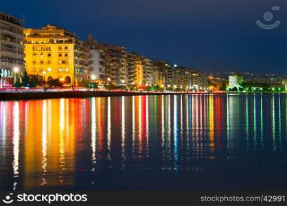 Embankment of Thessaloniki with reflection in the sea at twilight. Greece