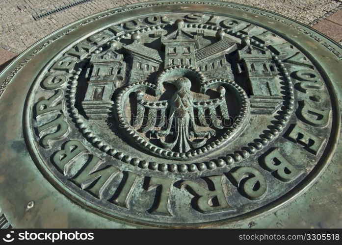 emblem of the city of berlin on an iron plate