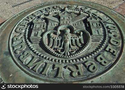 emblem of the city of berlin on an iron plate
