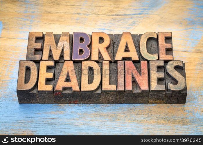 embrace deadlines - word abstract in vintage letterpress wood type blocks