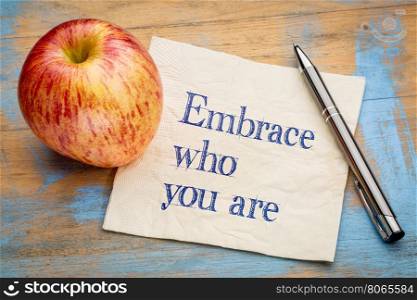 Embrace who you are - handwriting on a napkin with a fresh apple