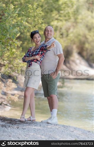embraced casual couple in the lake