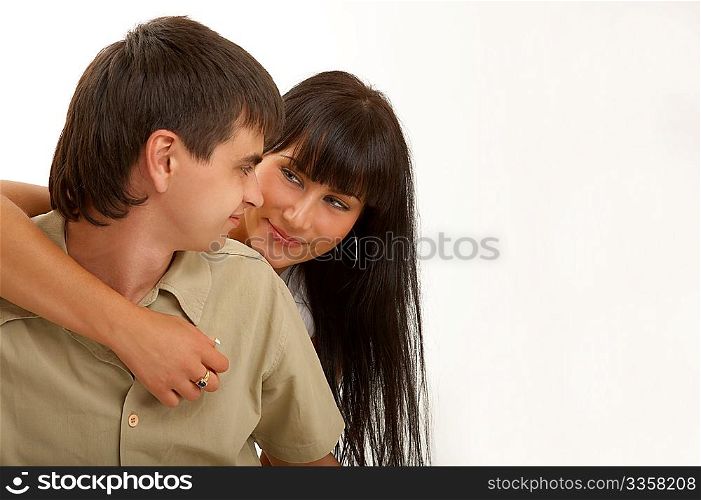 Embraces of happy pair on a white background