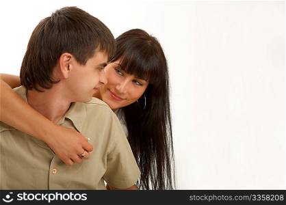 Embraces of happy pair on a white background