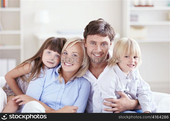 Embracing a happy family with children at home