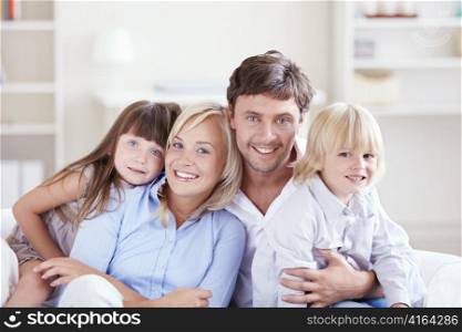 Embracing a happy family with children at home
