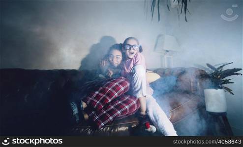 embracing teens watching spooky film