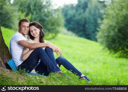 Embracing young couple in the park