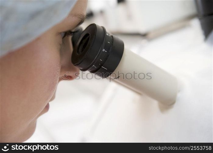 Embryologist adding sperm to egg