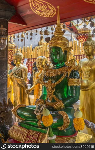 "Emerald Buddha shrine at Doi Suthep Buddhist Temple near Chiang Mai in northern Thailand. (The temple is often referred to as "Doi Suthep" although this is actually the name of the mountain it is located on)."
