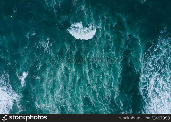 Emerald foamy ocean waves aerial drone top view