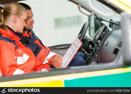 Emergency ambulance car paramedics sitting medical work female doctor