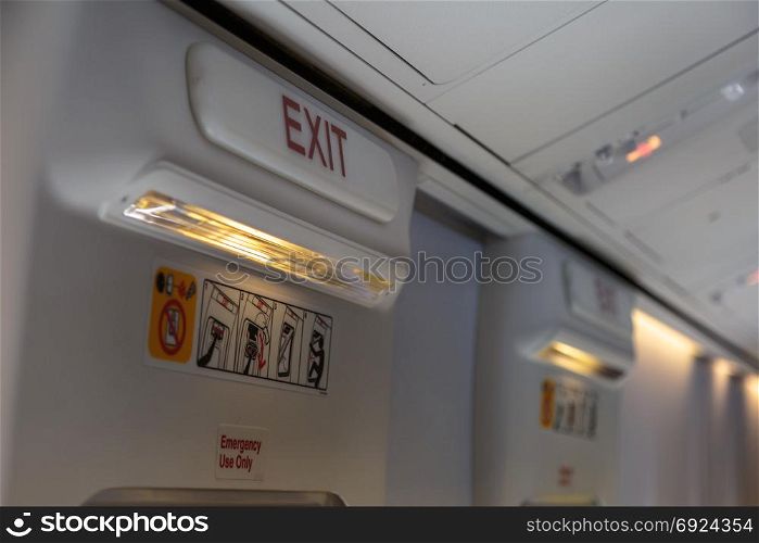Emergency Exit and Light in Aircraft Cabin